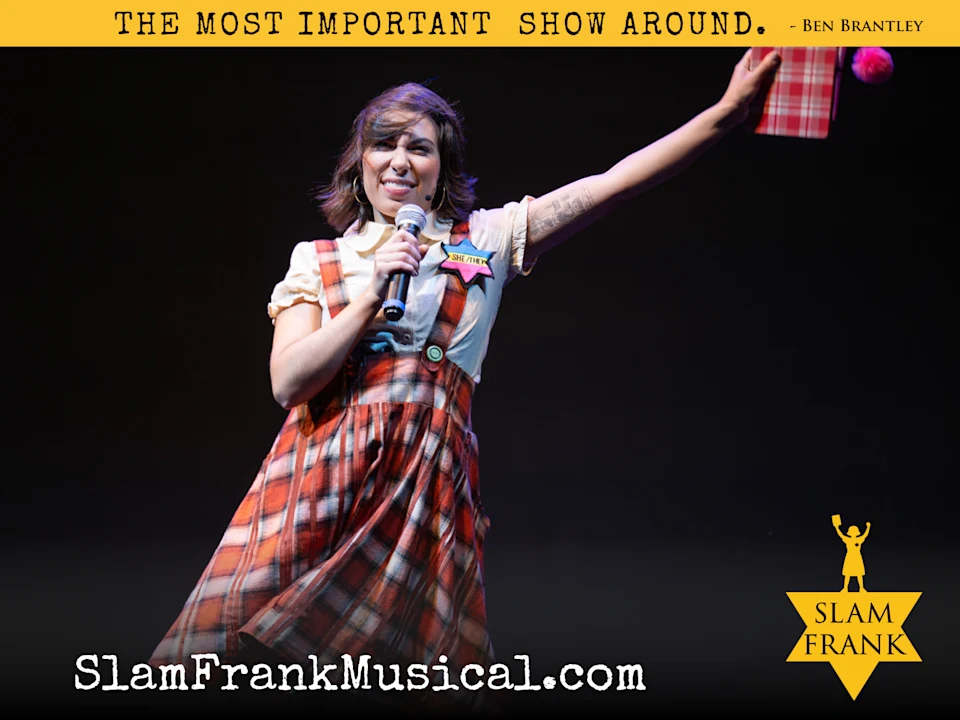 A performer in a plaid dress holds a microphone and a gift box on stage. Text above reads “The Most Important Show Around.” and below is "SlamFrankMusical.com".