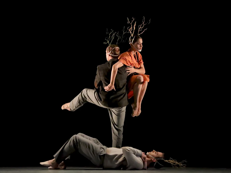 Production photo of 10,000 Dreams: A Celebration of Asian Choreography in Washington, showing three dancers perform on stage.