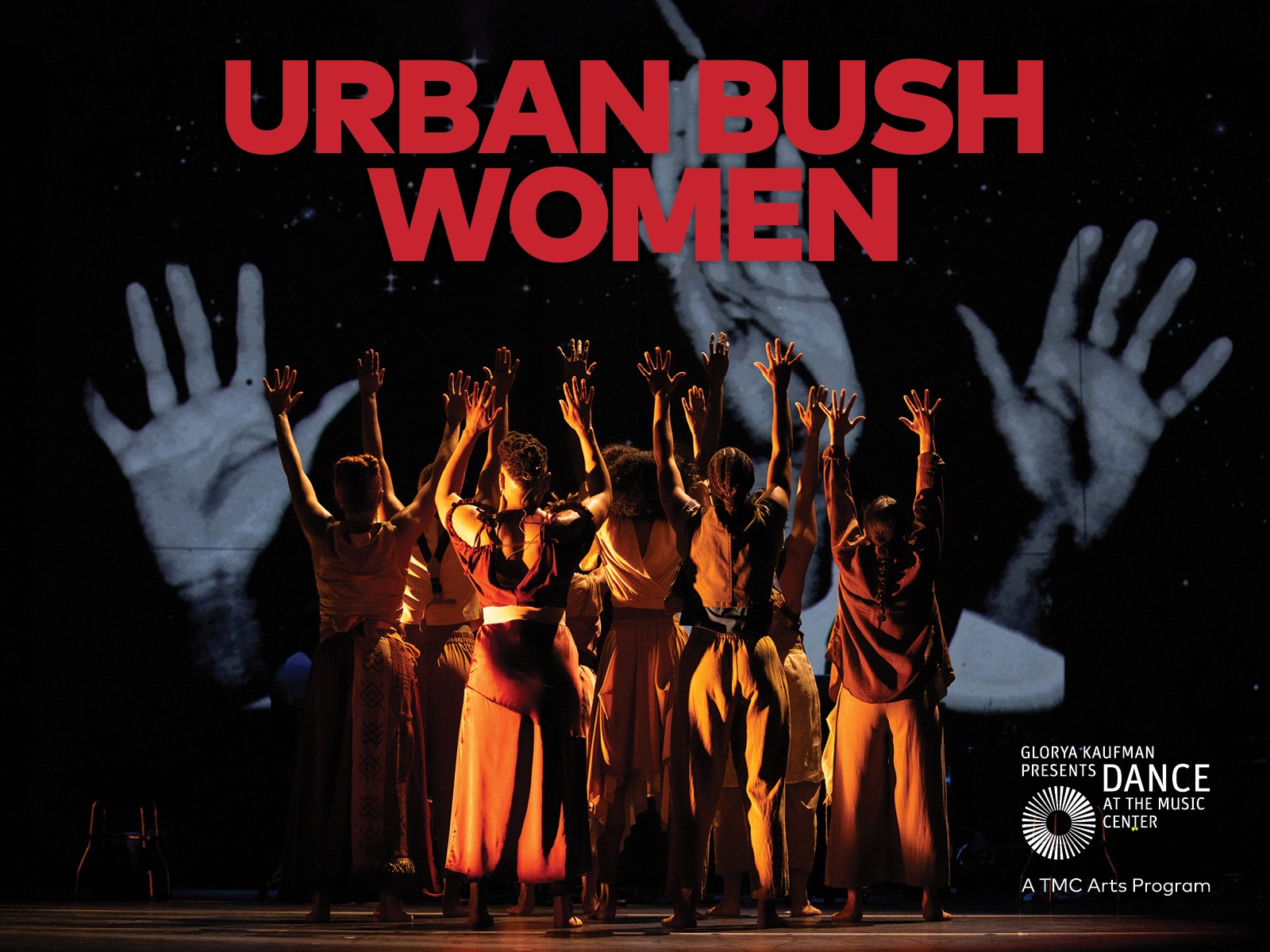A group of dancers stand with raised arms under the text "Urban Bush Women." In the background, large projected hands are visible.