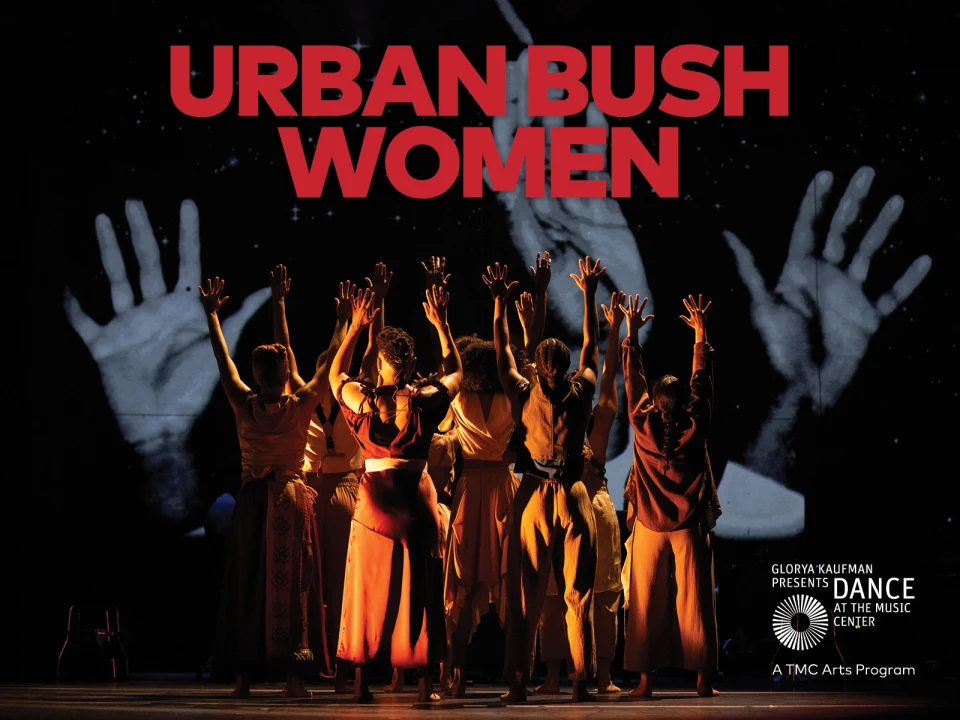 A group of dancers stand with raised arms under the text "Urban Bush Women." In the background, large projected hands are visible.