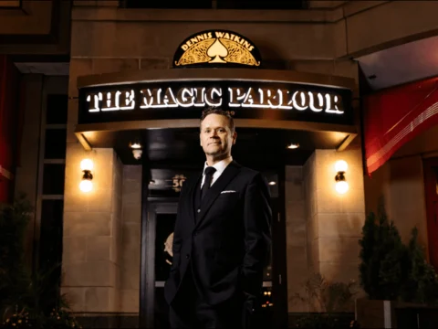 The Magic Parlour with Dennis Watkins in front of Marquee