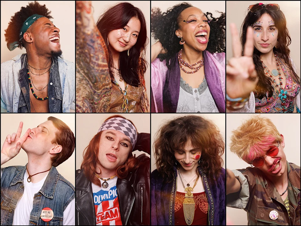 Eight people dressed in colorful, retro, bohemian-style clothing pose individually, smiling and making playful gestures against a plain background.