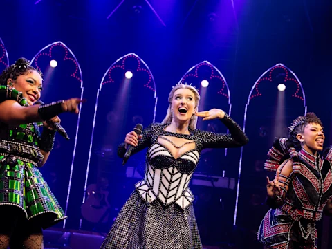 Production shot of Six in London featuring the company.