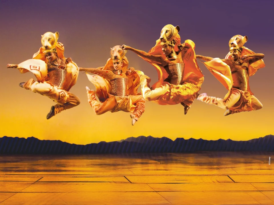 Production shot of The Lion King in London, showing "The Lionesses Hunt" dance.