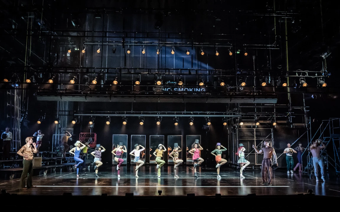 Production Image of A Chorus Line in Leicester Curve from 2021, featuring the full cast ensemble rehearsing the finale number.