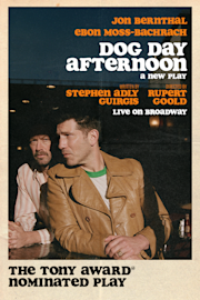 Two men sit at a cafe table, one in a brown leather jacket and the other in a patterned shirt and hat. Text promotes the play "Dog Day Afternoon" live on Broadway.