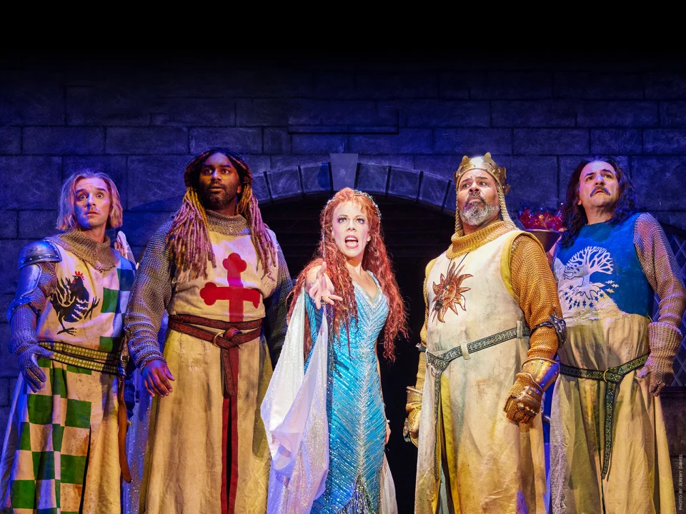 Production shot of Spamalot in New York, with Jonathan Bennett as Sir Robin, Nik Walker as Sir Galahad, Leslie Rodriguez Kritzer as The Lady of the Lake, James Monroe Iglehart as King Arthur and Jimmy Smagula as Sir Bedevere.
