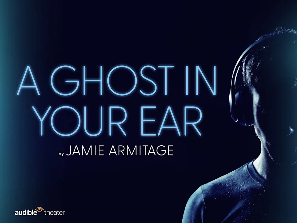 A person with headphones is partially visible on the right, next to neon text reading “A Ghost In Your Ear by Jamie Armitage.” Audible Theater logo is in the bottom left.