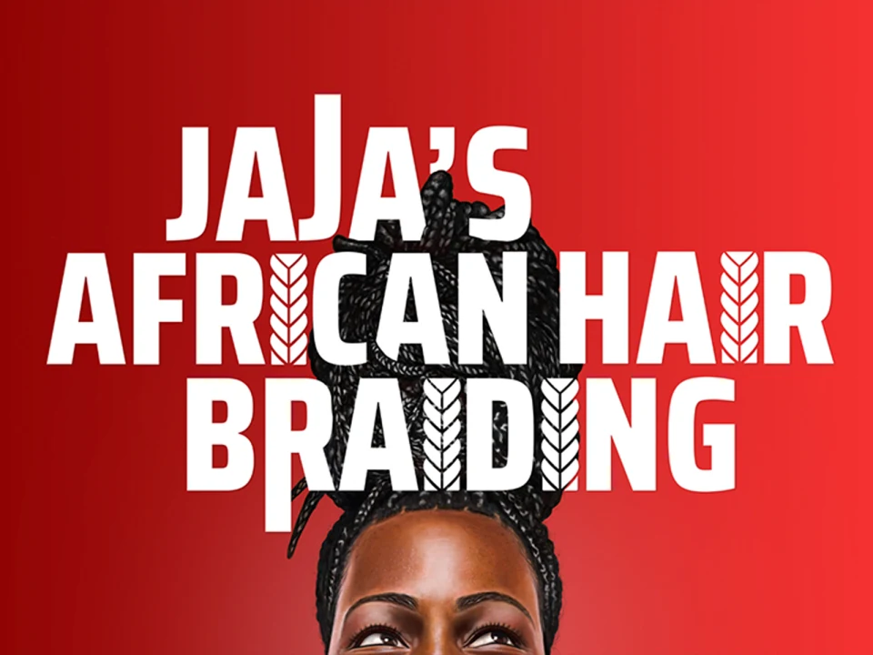 Image of a sign with bold text that reads "JaJa's African Hair Braiding" against a red background, partially covering the top of a person's braided hairstyle.