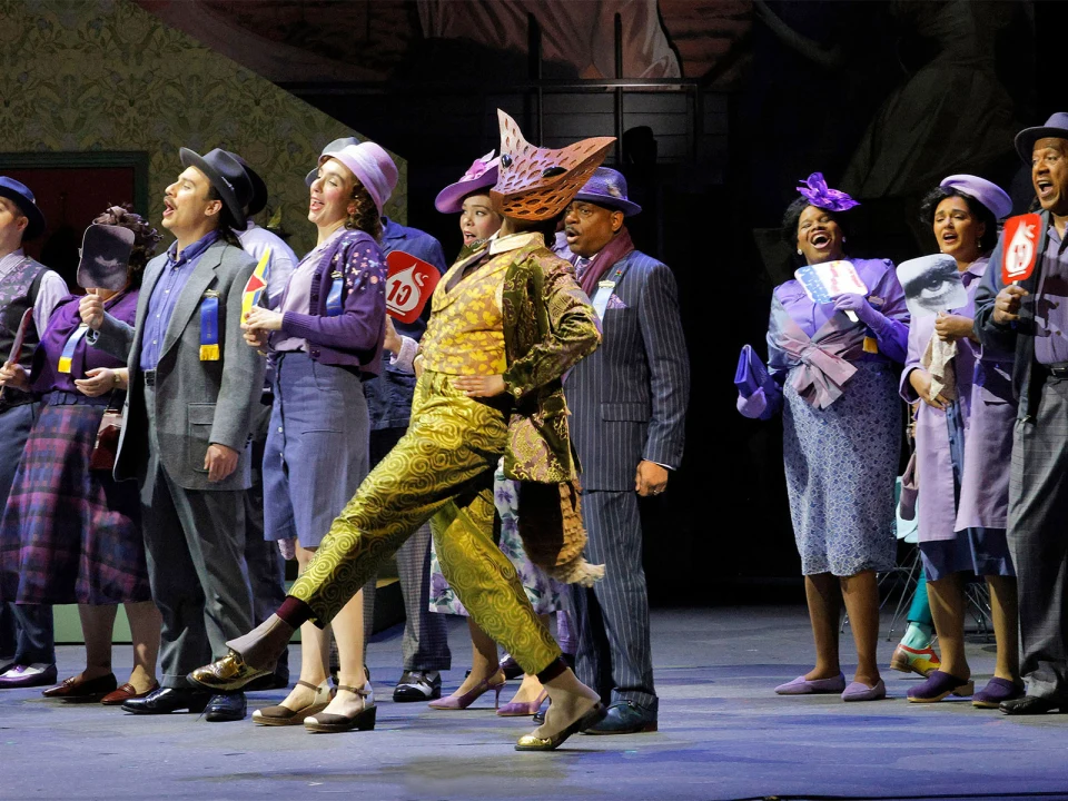 Production shot of Recovered Voices: Highway 1 USA/The Dwarf in Los Angeles, showing the group of performers singing and dancing together.