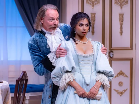 Production shot of Tartuffe in Los Angeles with Bo Foxworth as Orgon and Shanté DeLoach as Mariane.