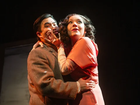 Production shot of The 39 Steps in San Francisco, Richard Hannay as Phil Wong and Anabella as Maggie Mason.
