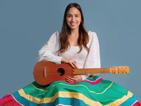 Production shot of Música in NYC, with Sonia De Los Santos holding a jarana, the traditional guitar from the south of Mexico.