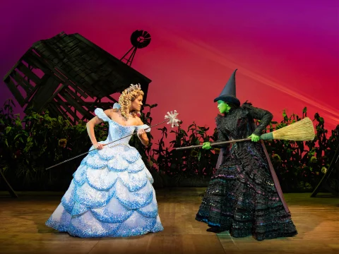 Production shot of Wicked in London with Lucy St. Louis as Glinda and Alexia Khadime as Elphaba.
