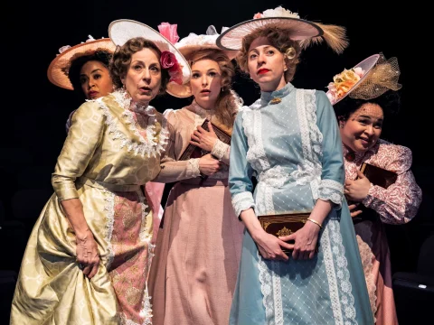 Production shot of Meredith Willson's The Music Man in Chicago, showing ladies looking.