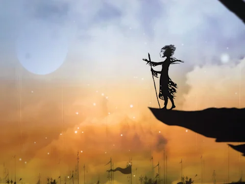 Silhouette of a figure holding a staff, standing on a cliff edge against a sunset sky with a glowing moon.