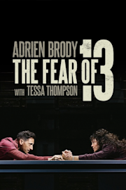 A man in burgundy scrubs stands in a hallway with "Adrien Brody The Fear of 13 with Tessa Thompson" written in large text over the image.
