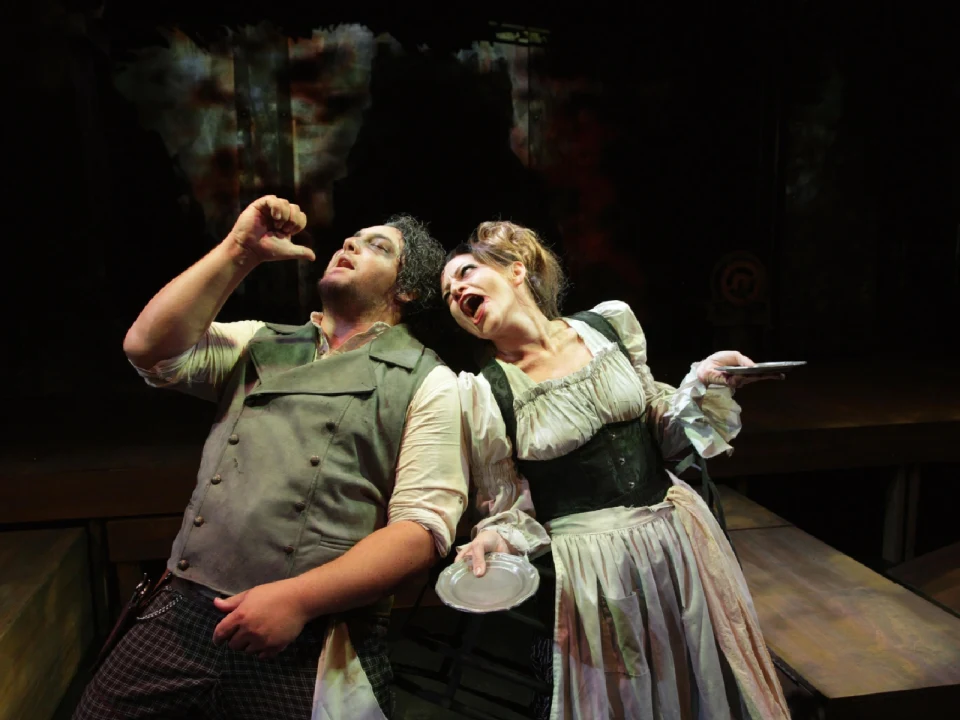 Production photo of Sweeney Todd: The Demon Barber of Fleet Street in California with Winston Peacock as Sweeney Todd and Jocelyn A. Brown as Mrs. Lovett.