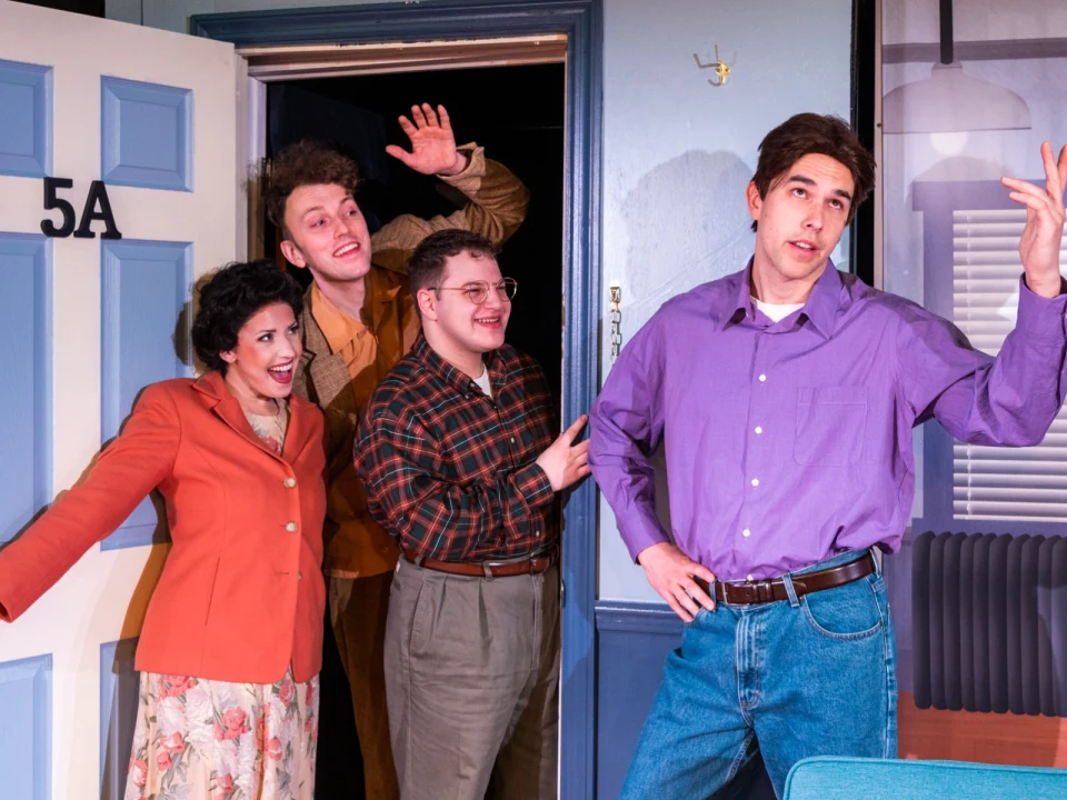 Production shot of Singfeld! A Musical About Nothing, with Trent Dahlin as Jerry, Hannah Hakim as Elaine, C.J. Russo as George and Caleb Funk as Cosmo.