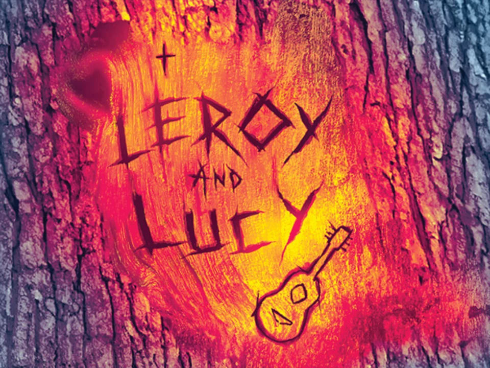 A tree bark has the names "Leroy and Lucy" and a small guitar drawing carved into it, with a background resembling flames.