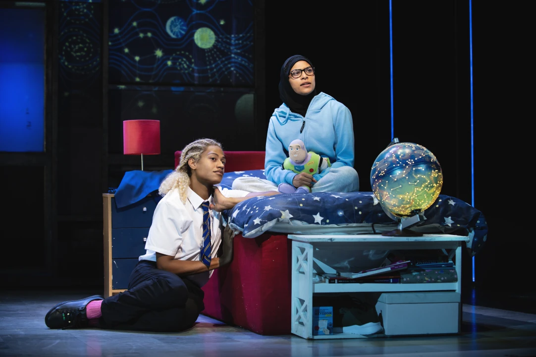 Production image of Everybody's Talking about Jamie in London, featuring Ivano Turco as Jamie and TALIA PALAMATHANAN as Pritt.
