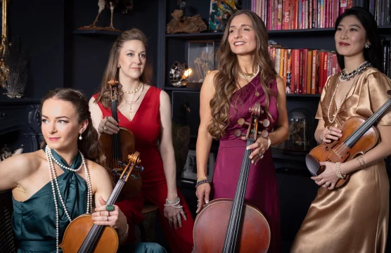 Production shot of Musicals by Candlelight in London showing ensembles holding their instruments.