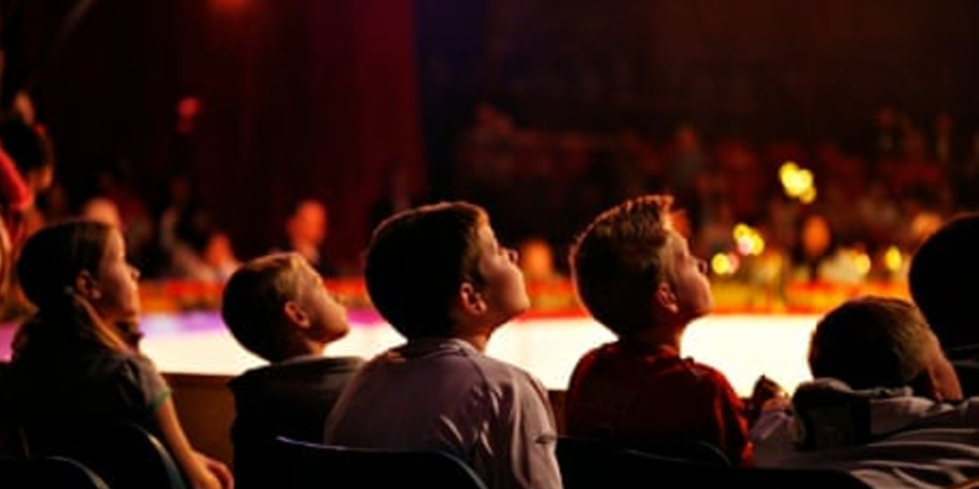 Photo credit: Children at the theatre (Photo by David Levene for The Guardian)