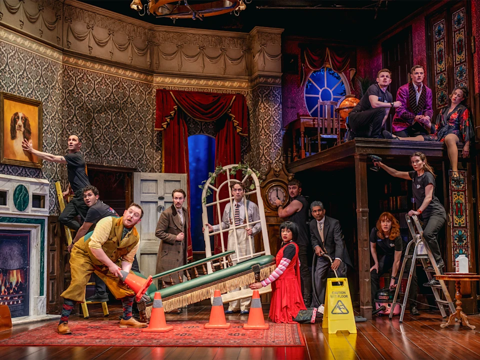 Production shot of The Play That Goes Wrong in London, featuring Daniel Anthony and Owen Jenkins