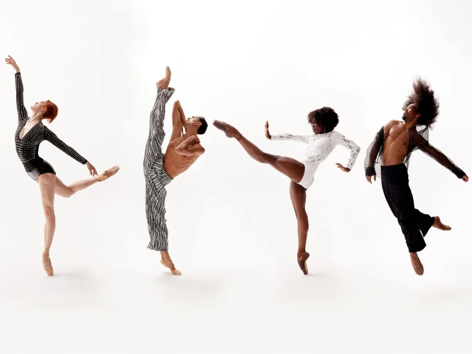 Four ballet dancers are mid-performance, dressed in varied costumes, striking different elegant poses against a plain white background.