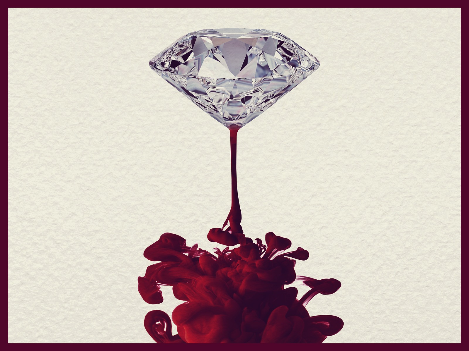 A diamond suspended above, with red ink or liquid swirling beneath it, against a textured light background.