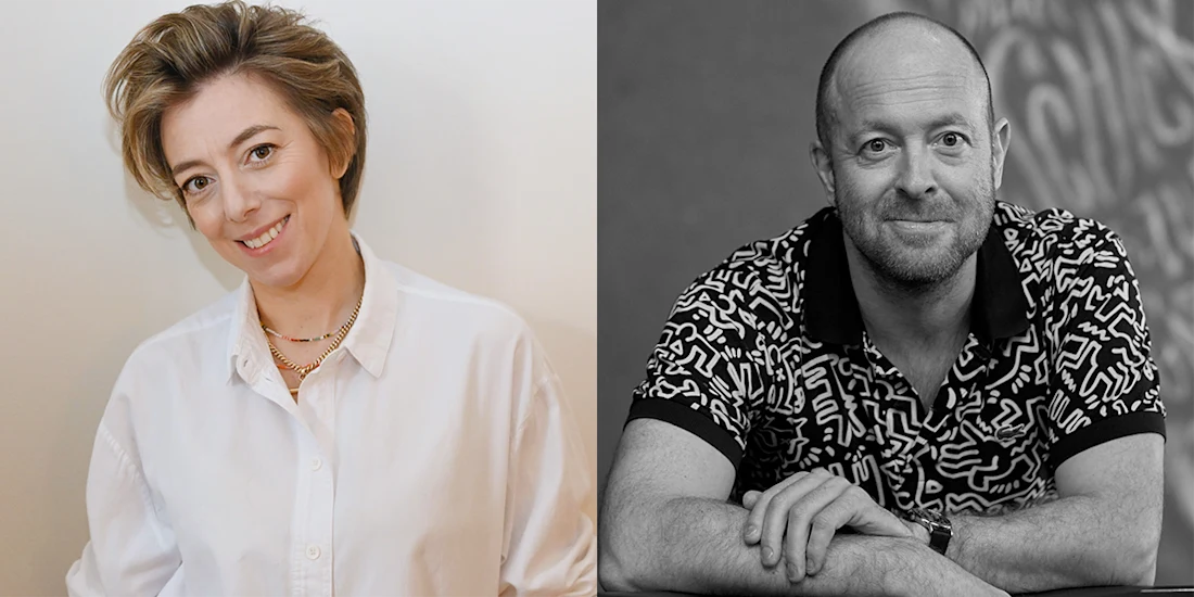 A woman in a white shirt smiles at the camera on the left; a man in a patterned shirt rests his arms on a table and looks forward on the right.