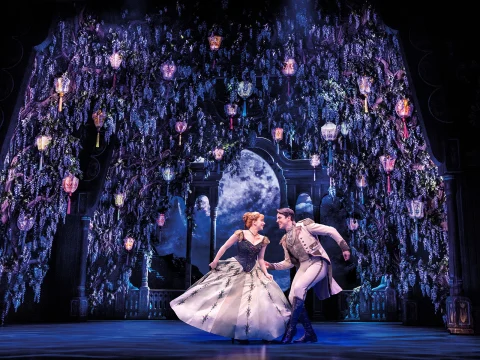 Production shot of Frozen the Musical in London, with Laura Dawkes as Anna and Oliver Ormson as Hans.