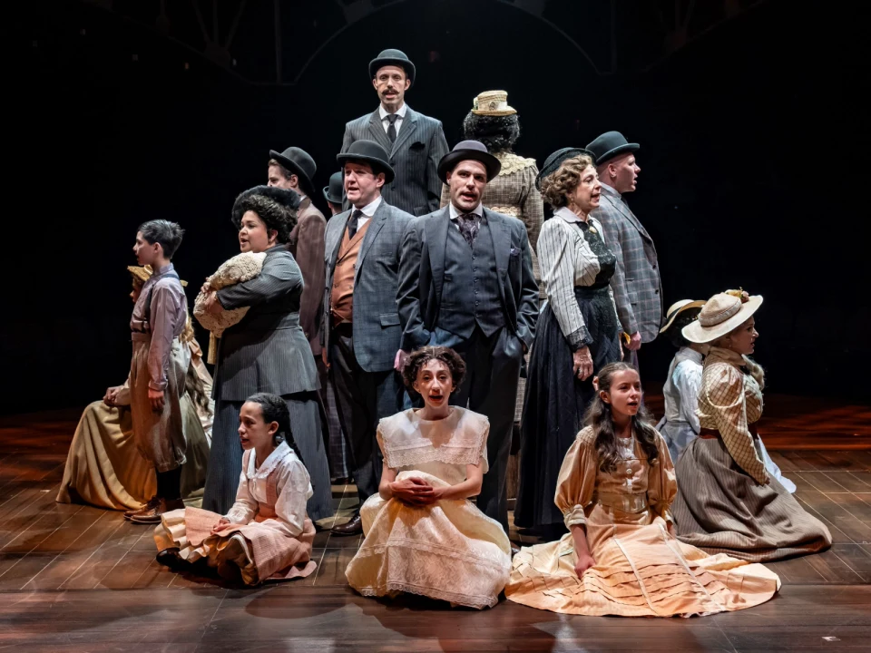 Production shot of Meredith Willson's The Music Man in Chicago, showing people singing.