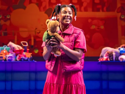 Production photo of Corduroy in Chicago with Demetra Dee as Lisa, a little girl in search of a friend.