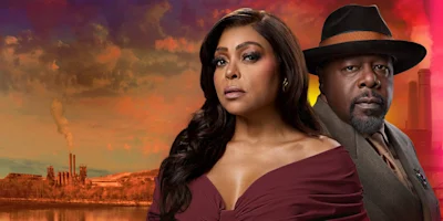 Two people in formal attire stand in front of an industrial landscape at sunset, with smokestacks and dramatic clouds in the background.