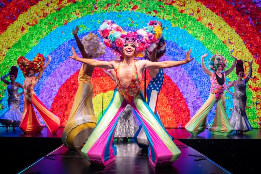 Production image of Priscilla the Party in London featuring full ensemble cast