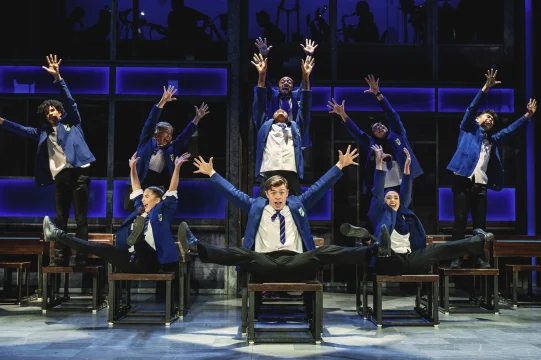 Production image of Everybody's Talking about Jamie in London, featuring the full West End cast.