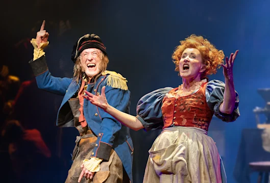 Production shot of Les Misérables in London, with Gerard Carey as Thénardier and Claire Machin as Madame Thénardier.