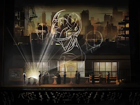 A theater stage shows people working with scientific equipment; a large anatomical head drawing and city skyline are projected on the backdrop as the audience looks on.