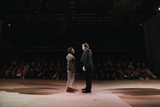 Production image of Quincy Tyler Bernstine and Michael Chernus on stage.