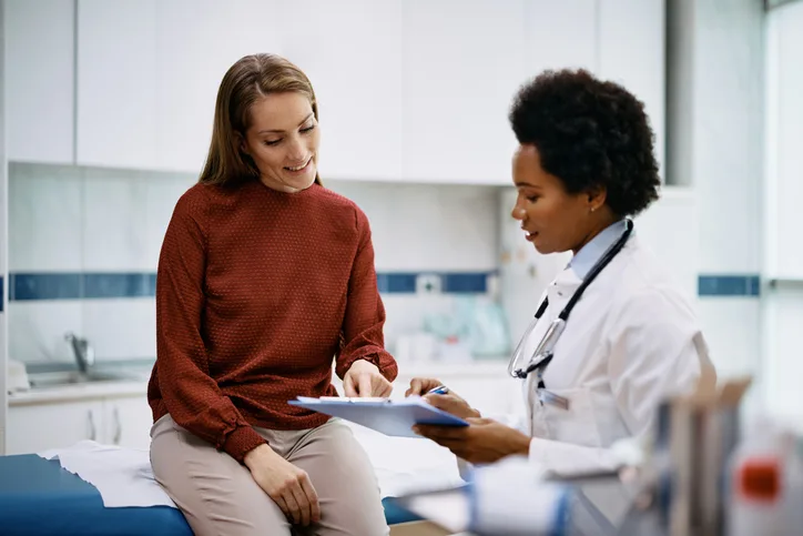 Photos of patients consulting with doctors in exam rooms. 