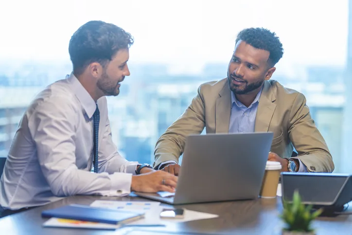 An employee and employer having a discussion.