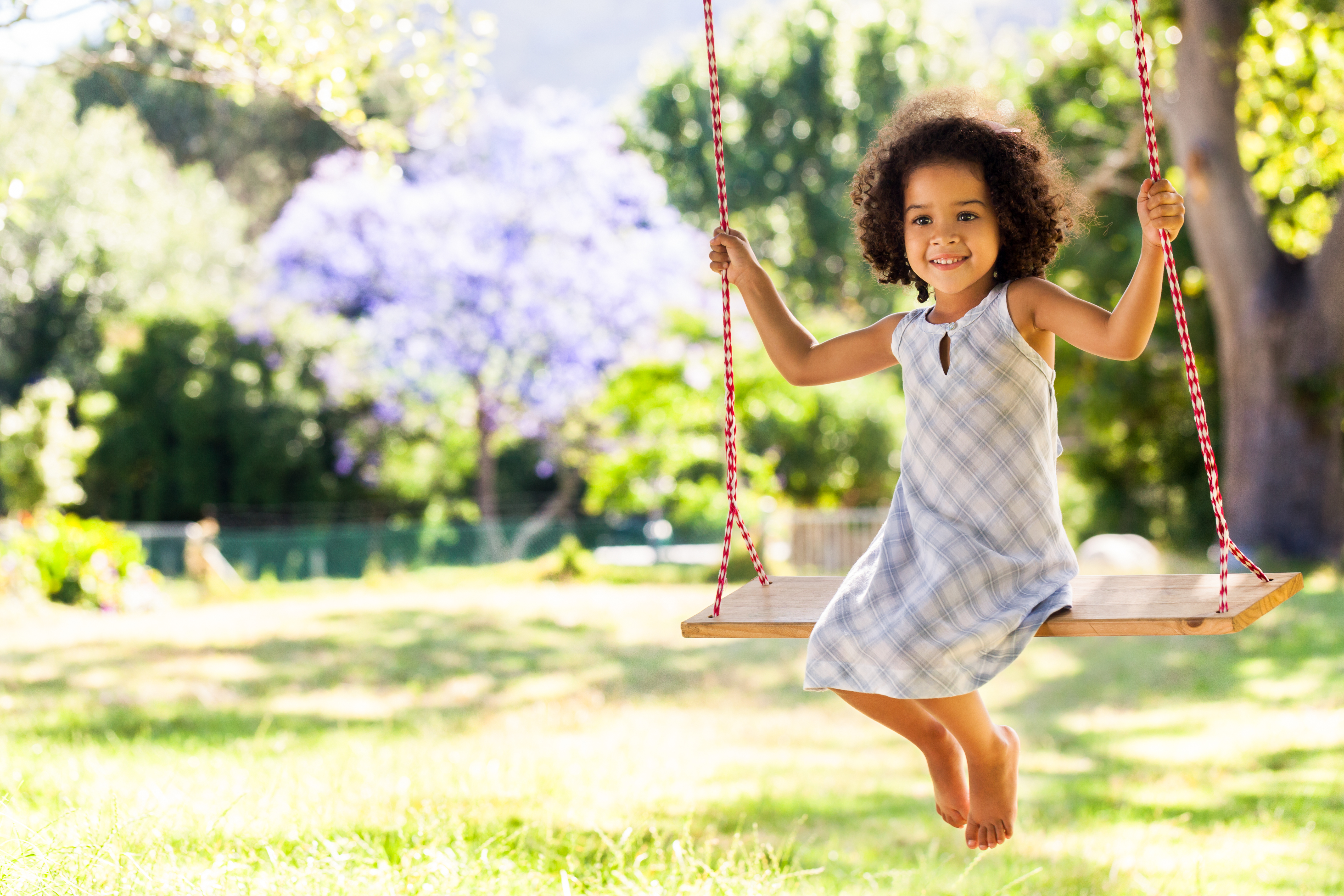 A child sitting on a swing