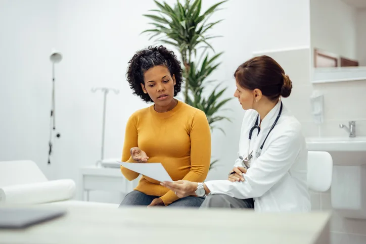 Patient and doctor discussing recovery goals.