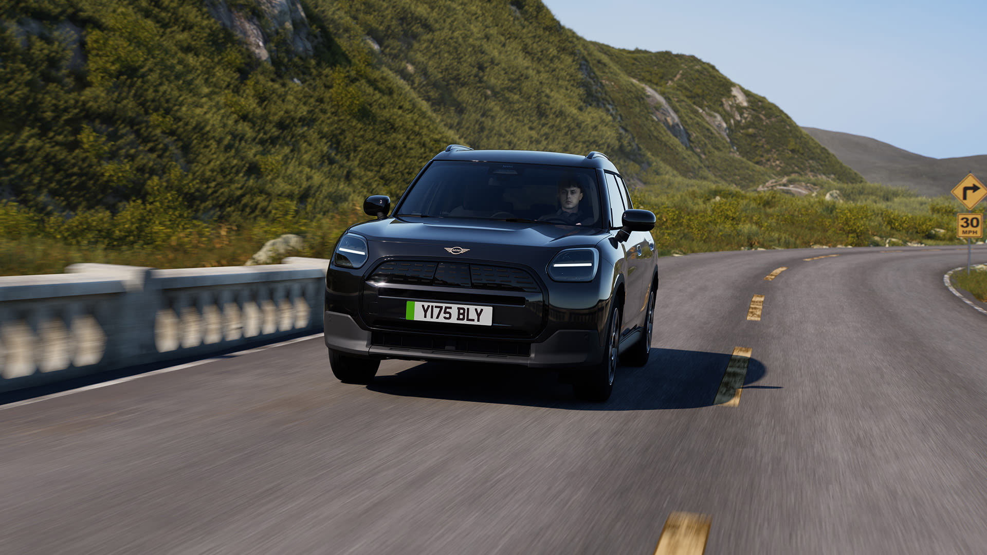 Monochrome MINI Countryman electric on a mountain road