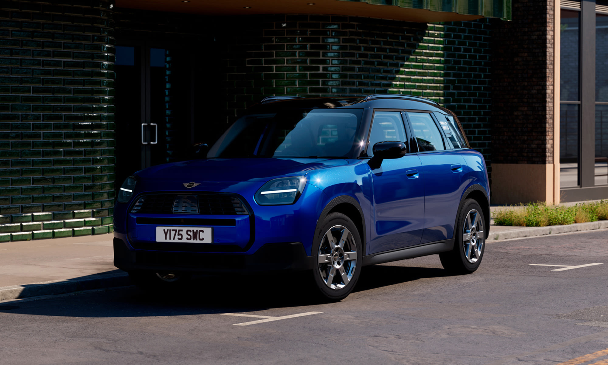 Blue MINI Countryman parked on a city street.