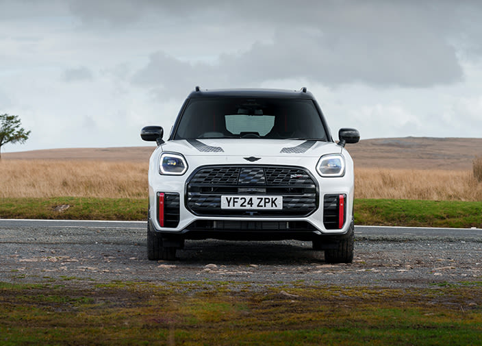 White MINI Countryman facing forward parked in a field