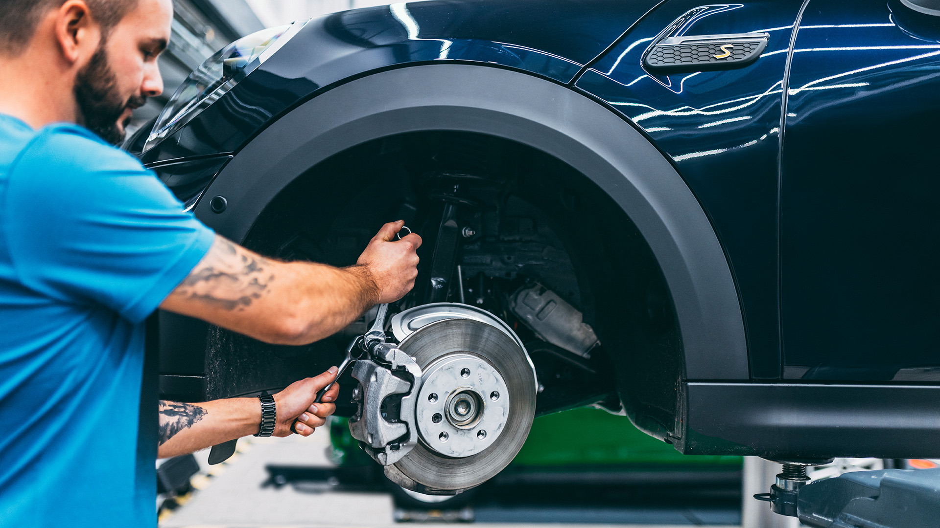 MINI Mechanic working on breaks