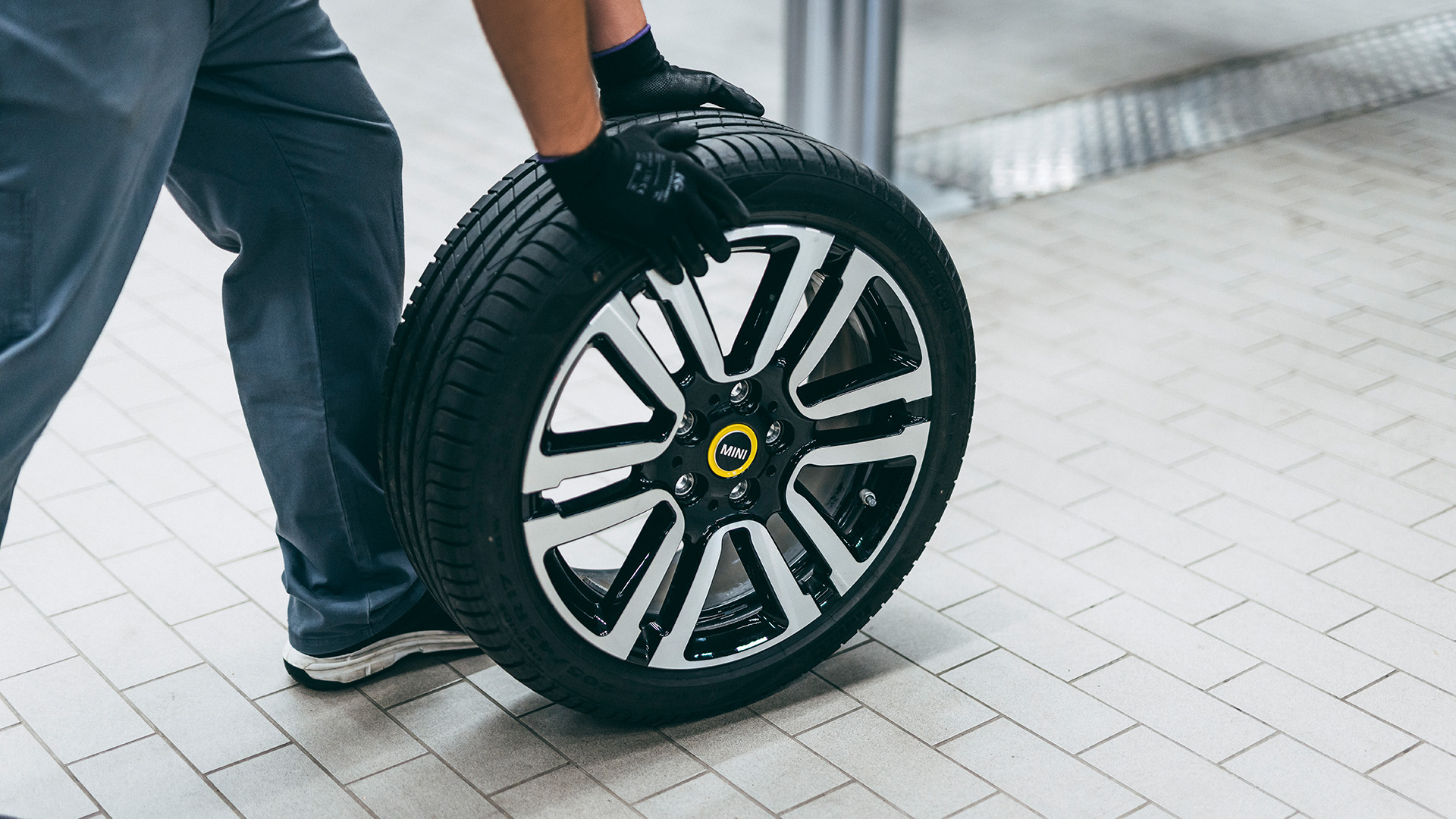 MINI Alloy wheel being tested/pushed by a mechanic