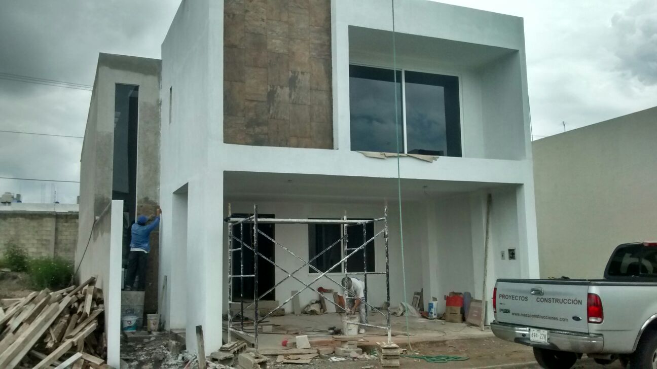 Construcción de torres departamentales y casas residenciales